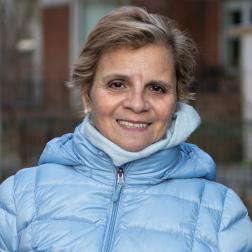 Ruby, a Citymeals volunteer in a blue winter coat. 