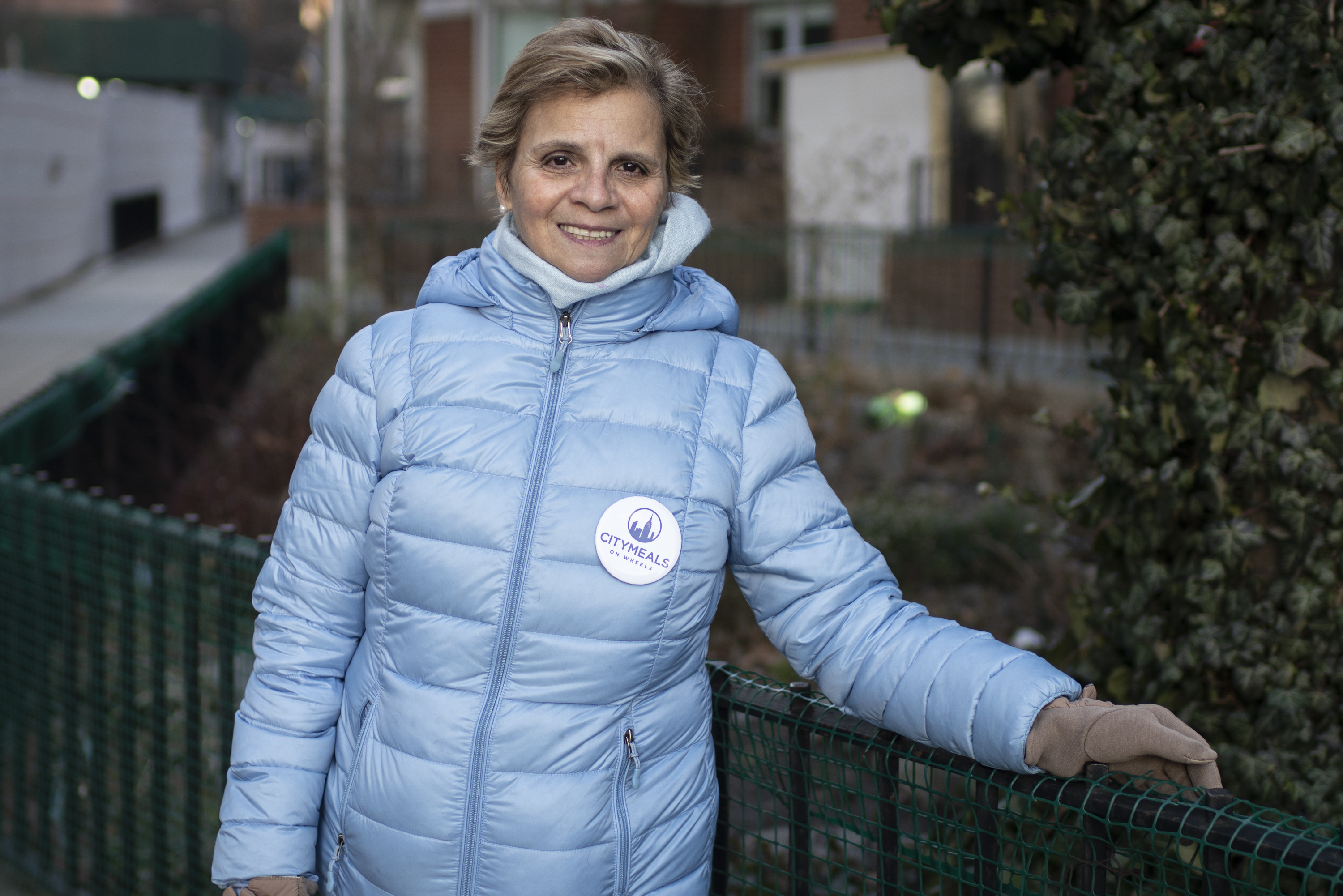 Ruby, a volunteer in a light blue winter coat.