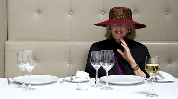 Gaele Green at a restaurant in one of her signature hats. 