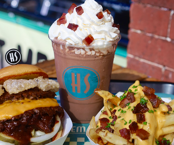 The Harlem Shake's Big Apple Pig Out Combo (bacon cheeseburger, bacon cheese fries, and chocolate bacon shake). Benefits Citymeals on Wheels.
