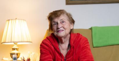 A photo of Dorothy, an older woman in a red sweater. 