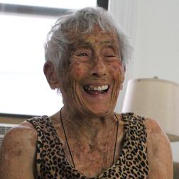 Citymeals on Wheels recipient Cozette, an older Asian-American woman in her Soho apartment in Manhattan