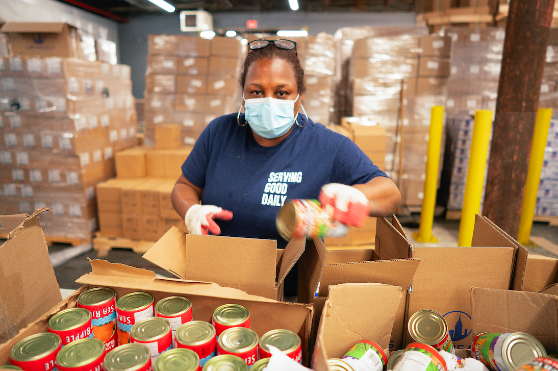 Caption: Staff became essential workers at our Emergency Meal Distribution Center.